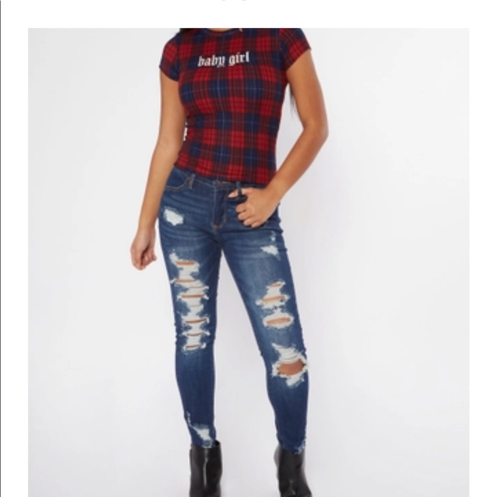 Mid rise distressed jeggings with raw hem.